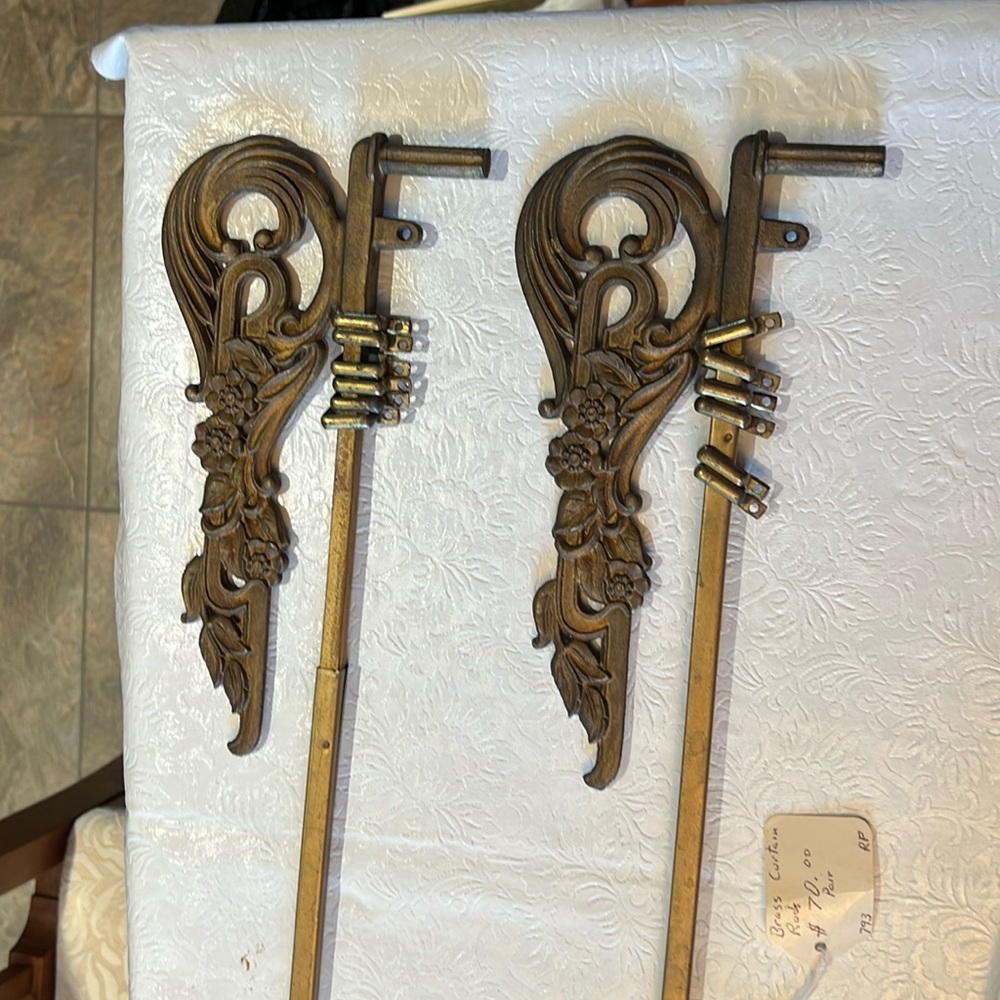 Antique solid brass extending curtain rods.